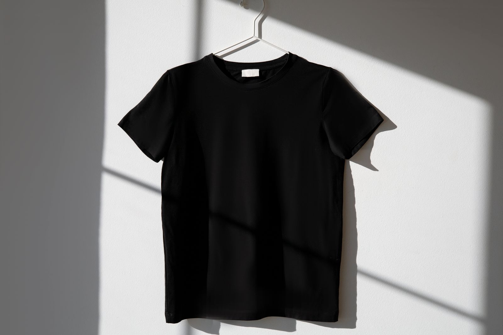 Custom photo t-shirt in black on a hanger — personalized print