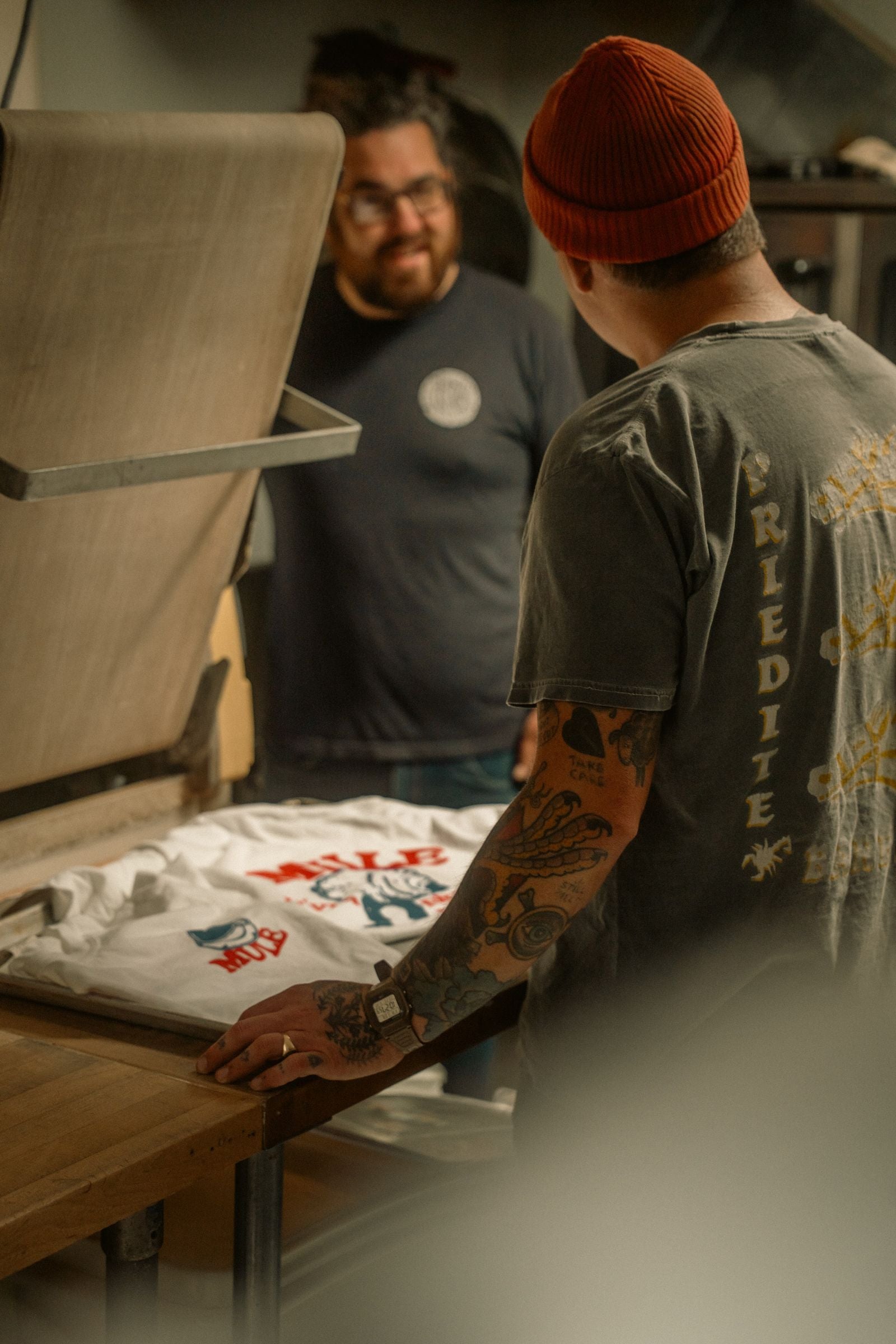 Screen printing a t-shirt in the workshop — how PrintedSoul works